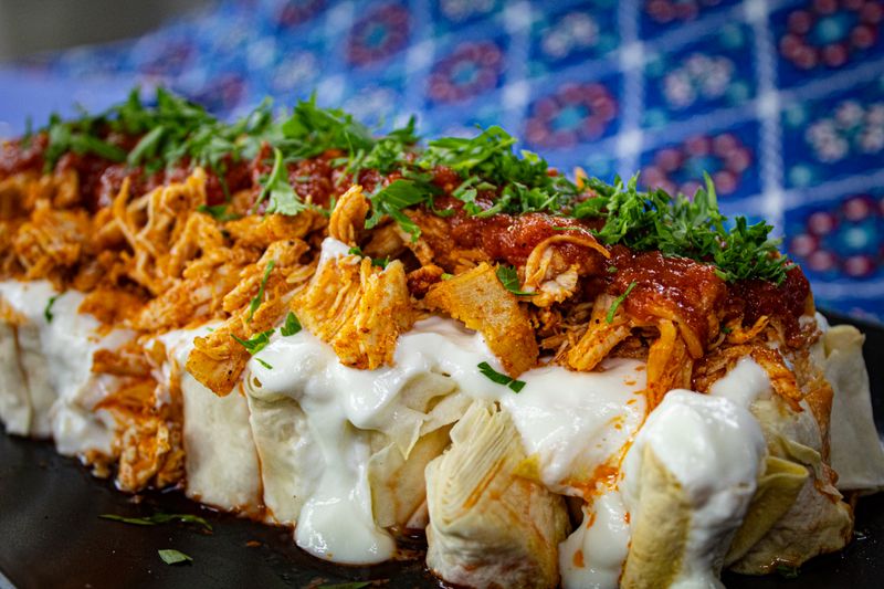 Chuys chicken mole enchiladas with rich dark sauce