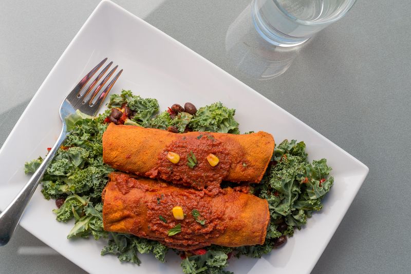 Chuys green chile pork enchiladas smothered in sauce