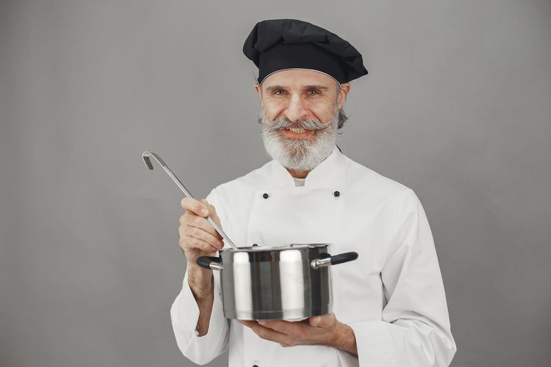 Chuys founder cooking in the original Charlotte kitchen